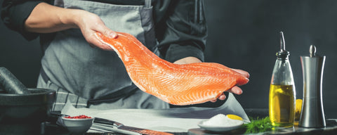 Chef preparing Salmon fillet